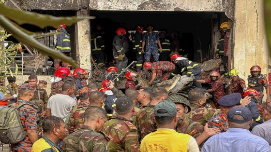 Firemen check the wreckage of a Bangladesh Air Force training aircraft that crashed onto a school campus in Dhaka, Bangladesh, Monday, July 21, 2025. (AP Photo/Al-emrun Garjon)